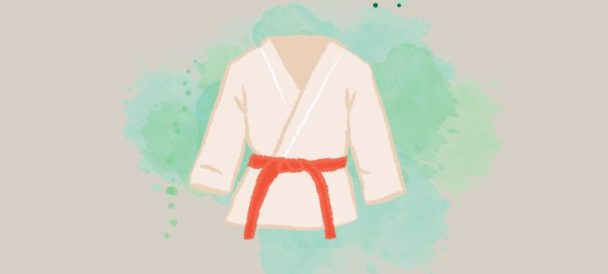 Grafika przedstawia górę od stroju do karate przewiązaną czerwonym pasem.
